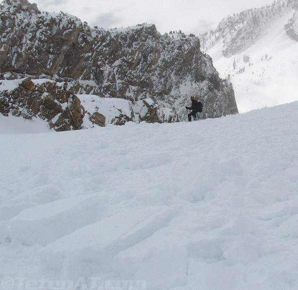 chris makes his way down the debris path